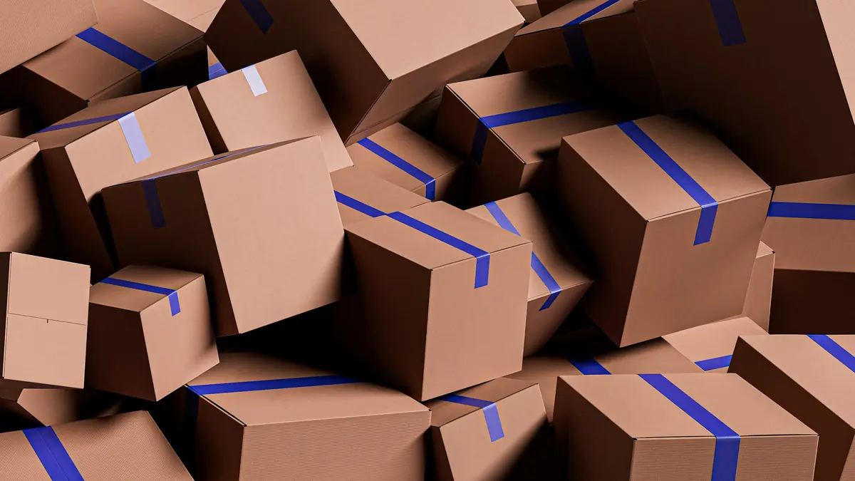 Stacked cardboard cartons of boxed products