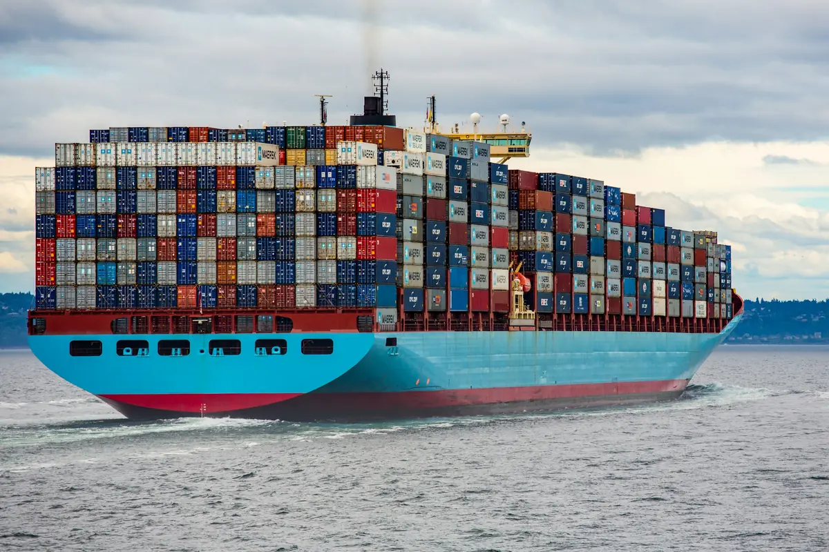 A container ship loaded with shipping containers at sea